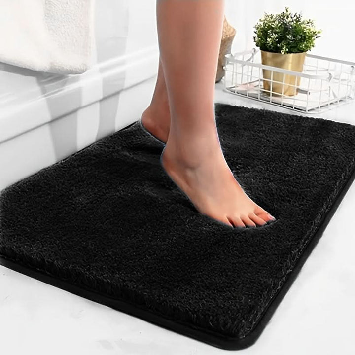 Non-slip bath mat, premium absorbent rug ensures bathroom safety & comfort. Soft plush mat for modern home decor.