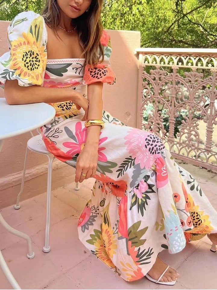 Chic women's white long dress with puff sleeves & square neck. A sophisticated maxi dress for summer or special events.