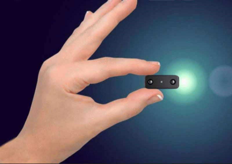 Discreet 1080P mini camera for surveillance, featuring night vision and wireless capabilities.