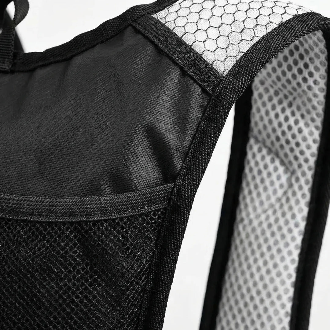 Lightweight, durable 10L hydration backpack. Ideal for outdoor trail cycling. Water repellent, compact, black.