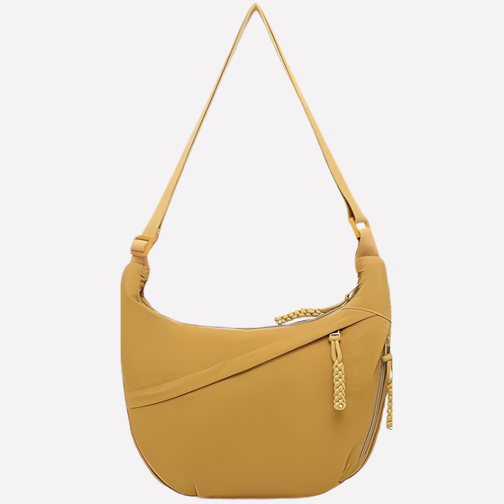 Modern women's crescent-shaped crossbody bag, a practical nylon sling purse for urban adventures.