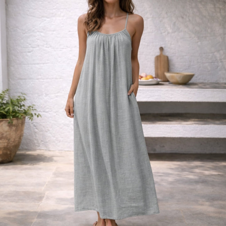 Stylish women's solid color spaghetti strap maxi sundress, a chic summer fashion essential.