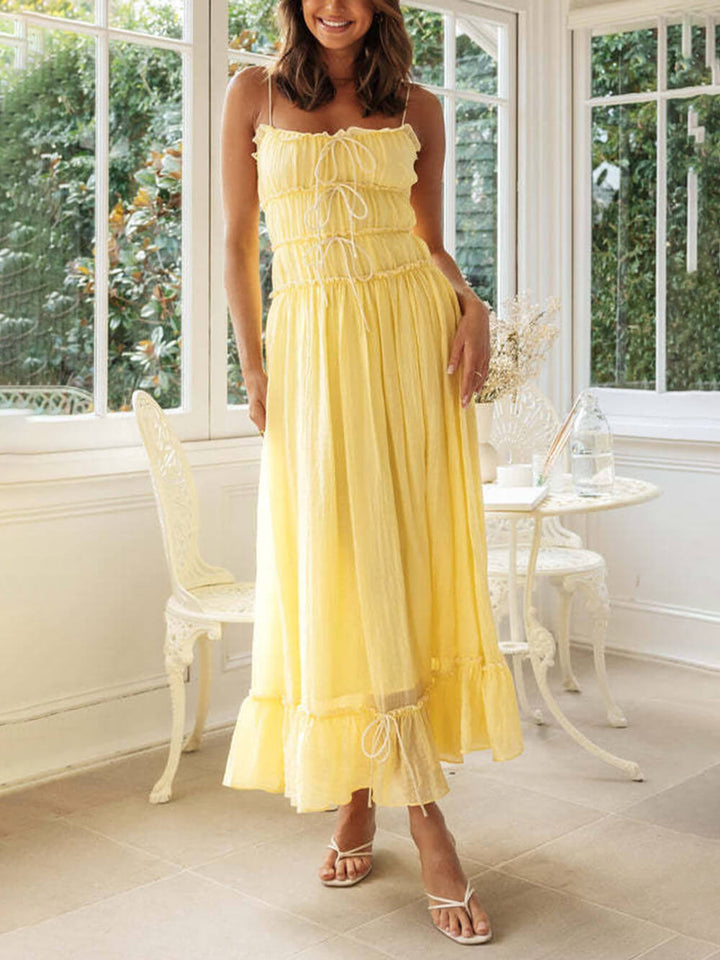 Flowy bohemian midi sundress for women, spaghetti straps, comfortable summer beach wear.