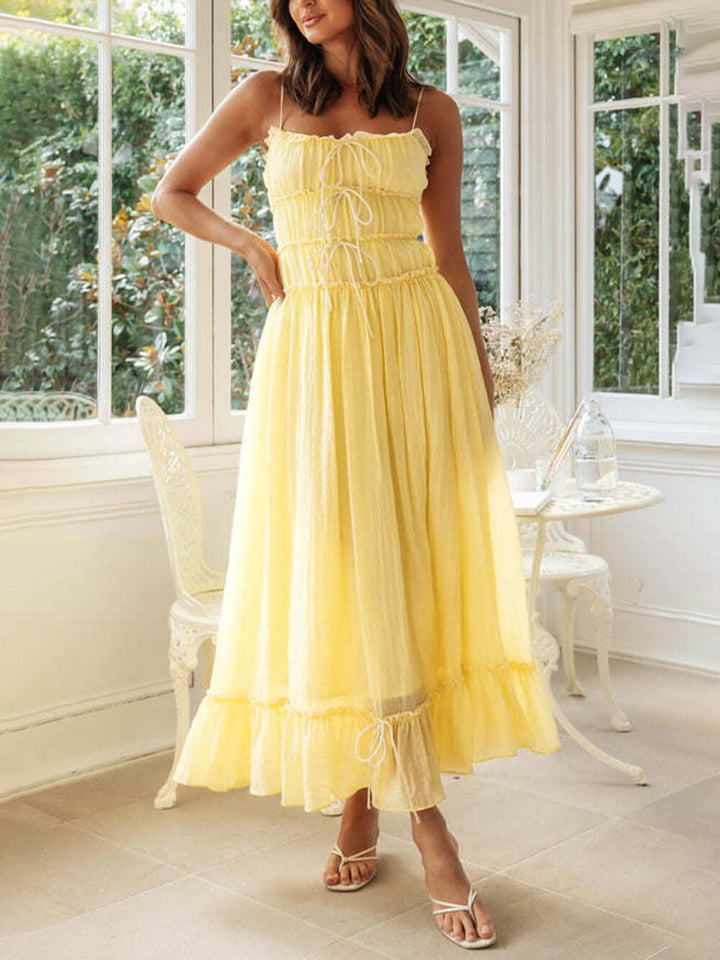 Chic women's boho midi sundress with delicate spaghetti straps, ideal for summer vacation.