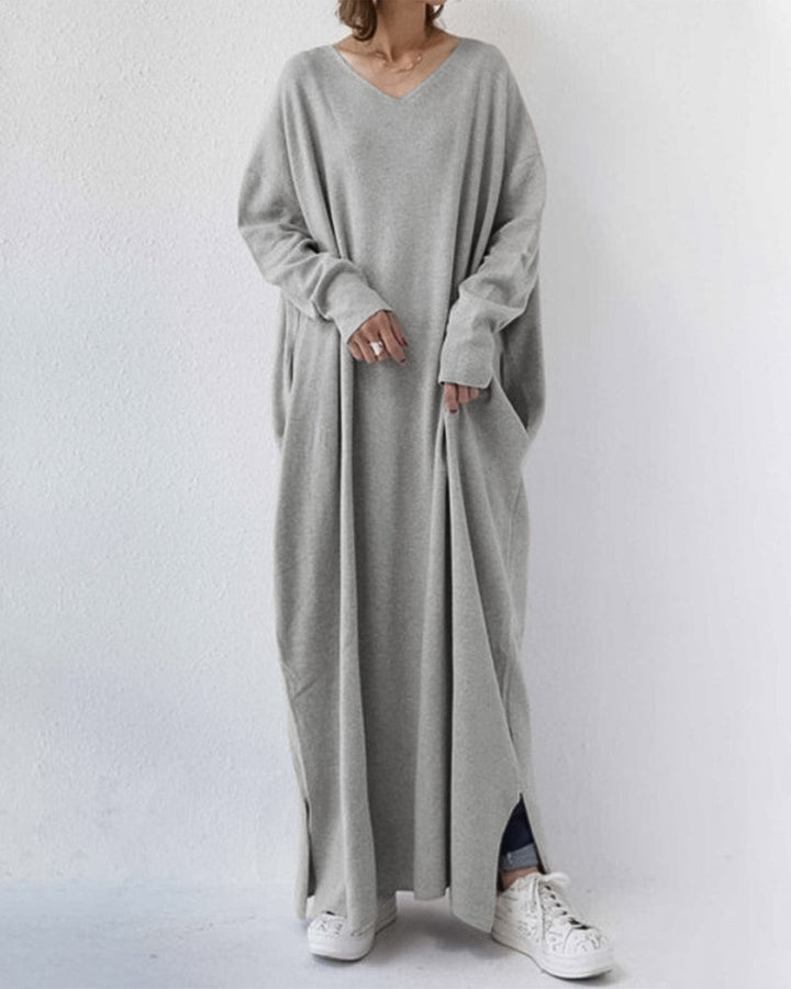 Women's elegant winter maxi dress with flowing long sleeves, perfect for formal or evening wear.