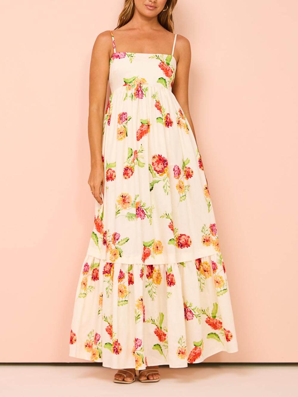 Women's sleeveless beige open-back maxi sundress, an effortless and comfortable summer vacation dress.