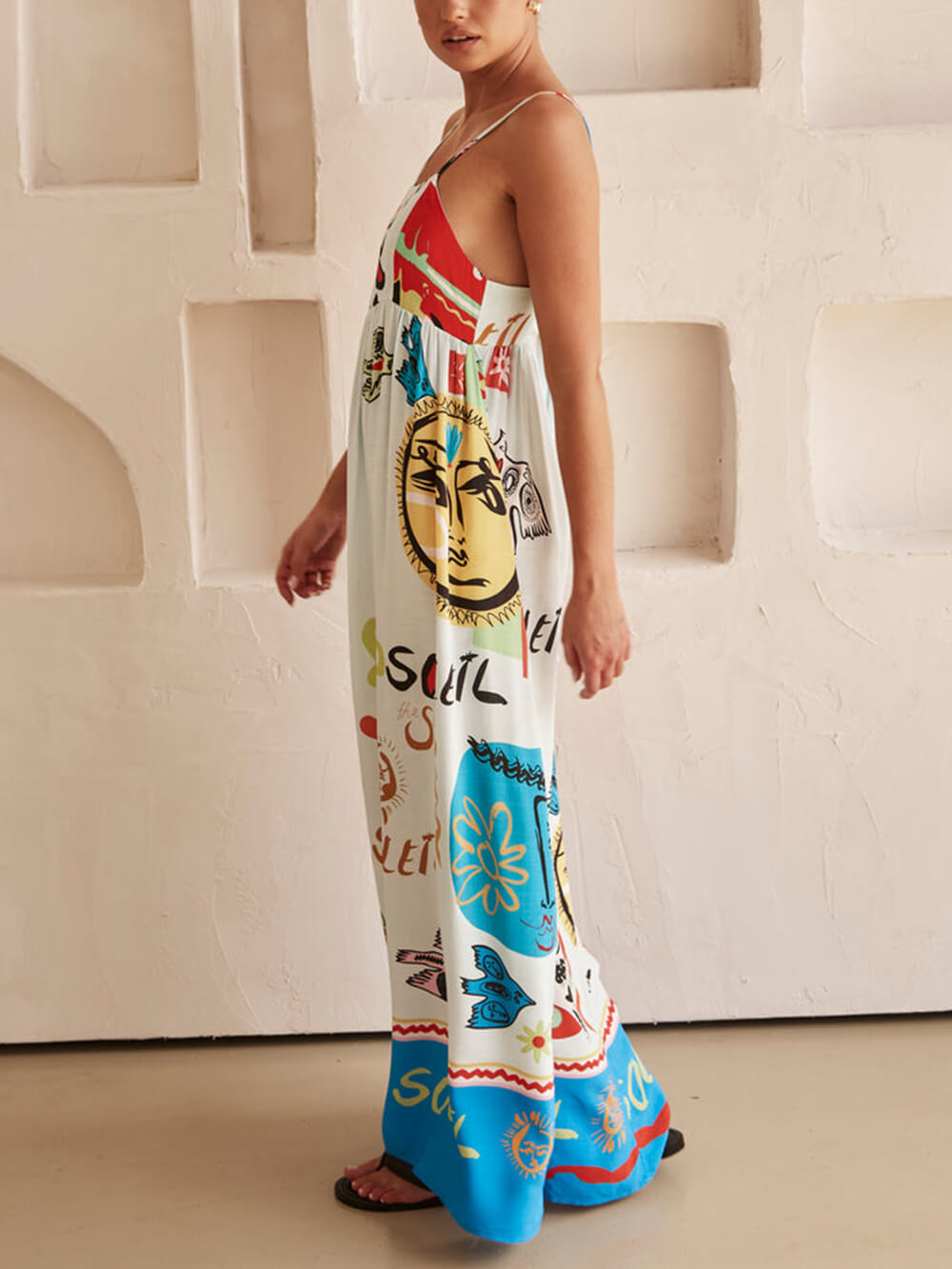 Elegant white flowy maxi dress in boho style for women. Ideal for summer casual wear & everyday comfort.
