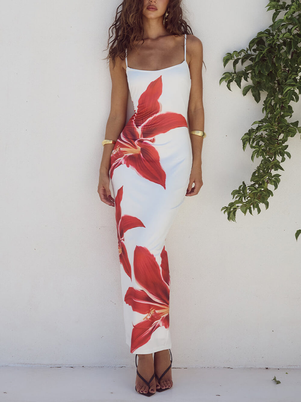 Back view of an elegant women's floral print maxi dress, suitable for summer beach events.