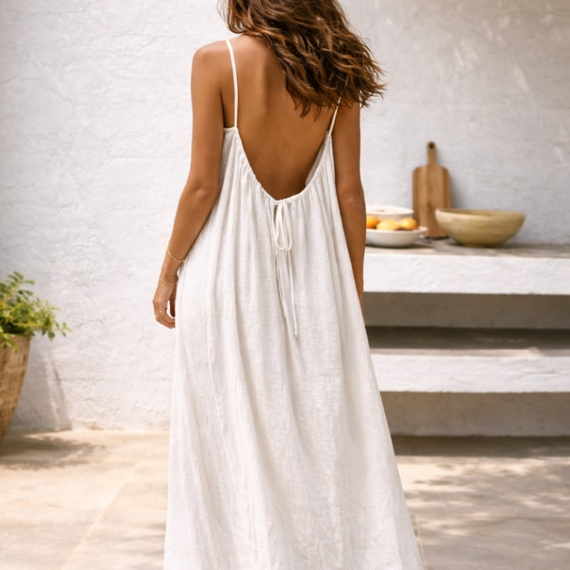 Flowing women's spaghetti strap long sundress, embodying summer fashion and effortless elegance.