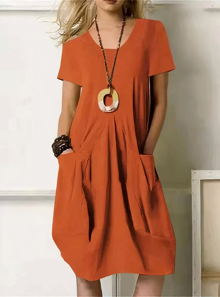 Lightweight women's summer dress with a relaxed fit, short sleeves, and versatile style for warm-weather fashion.