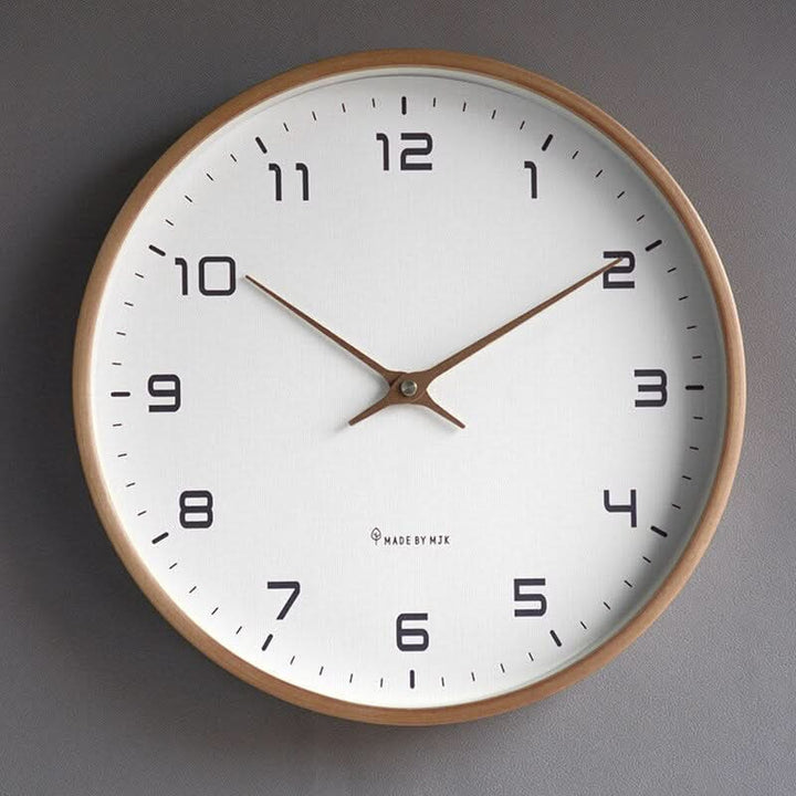 Modern Scandinavian wooden wall clock on a wall, minimalist beige design. Ideal for contemporary home or office decor.