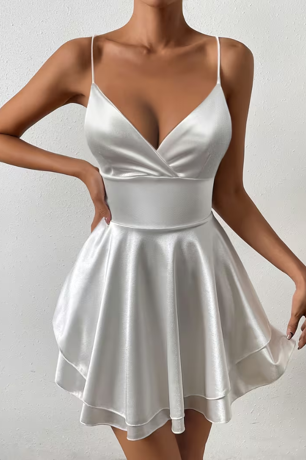 Elegant women's swing dress with open back and pleated skirt. Perfect for cocktail parties & special occasions.
