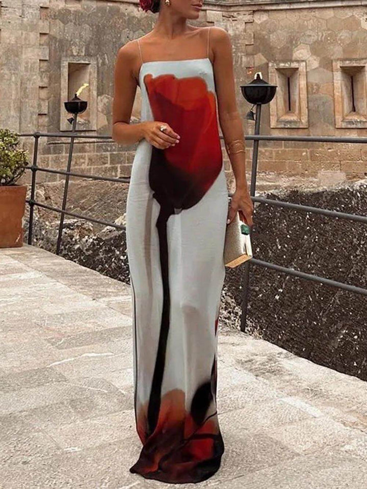Women's casual flowing maxi dress with an abstract print, ideal for elegant summer and vacation wear.