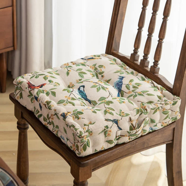 Padded unisex seat cushion with ties for dining chairs or patio furniture, enhancing comfort & home decor.