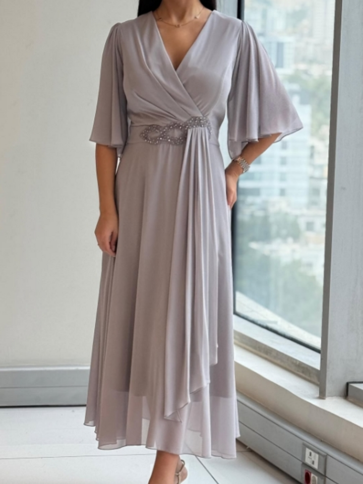 Women's V-neck maxi dress with flowy design & adjustable straps. Perfect comfortable summer casual wear.