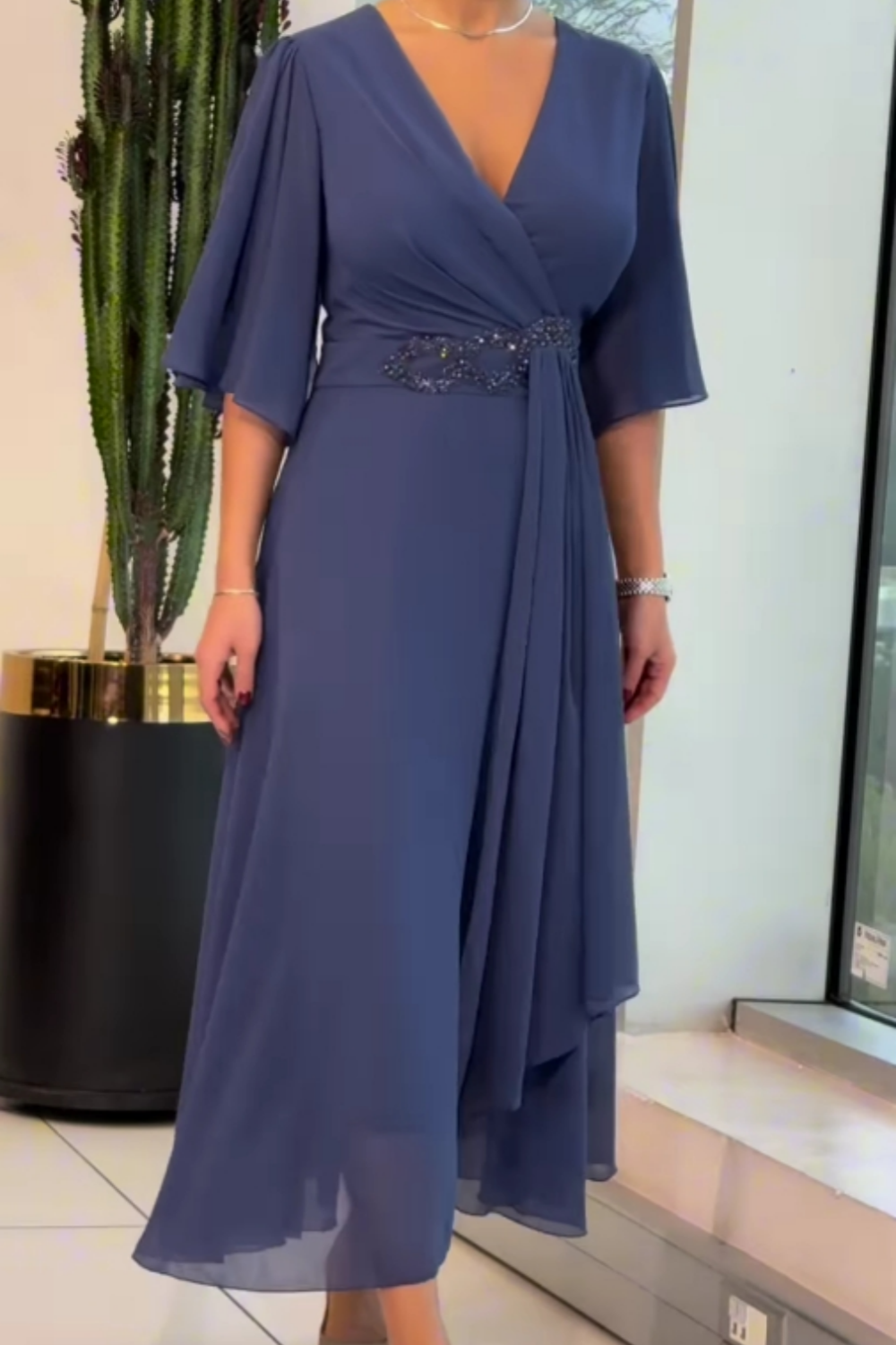 Elegant women's long V-neck maxi dress. Flowing design with adjustable straps for day to night style.