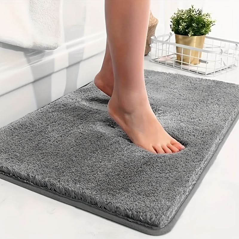 Premium ultra-soft absorbent bath mat for bathroom safety. Plush, non-slip bathroom rug, quick-drying.