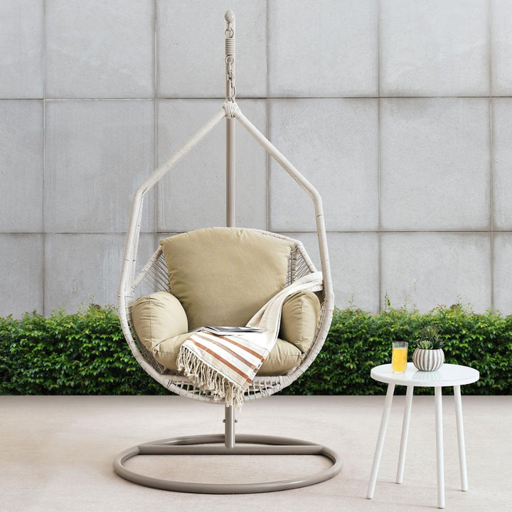 Comfortable cream hanging egg chair, a stylish swing for your outdoor patio or porch.