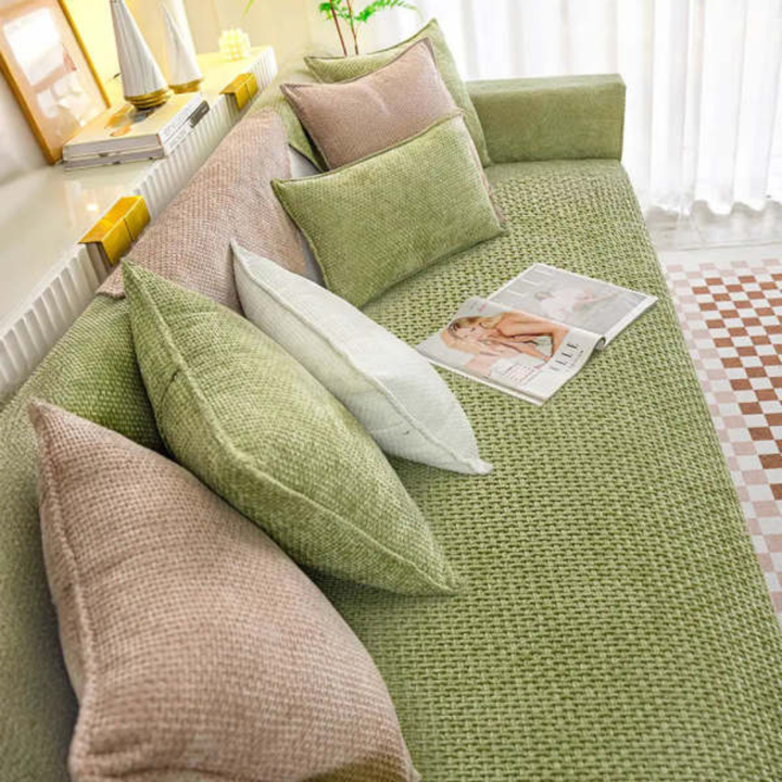 Soft velvet couch cover with non-slip backing, protecting furniture from pets. Washable & stylish.
