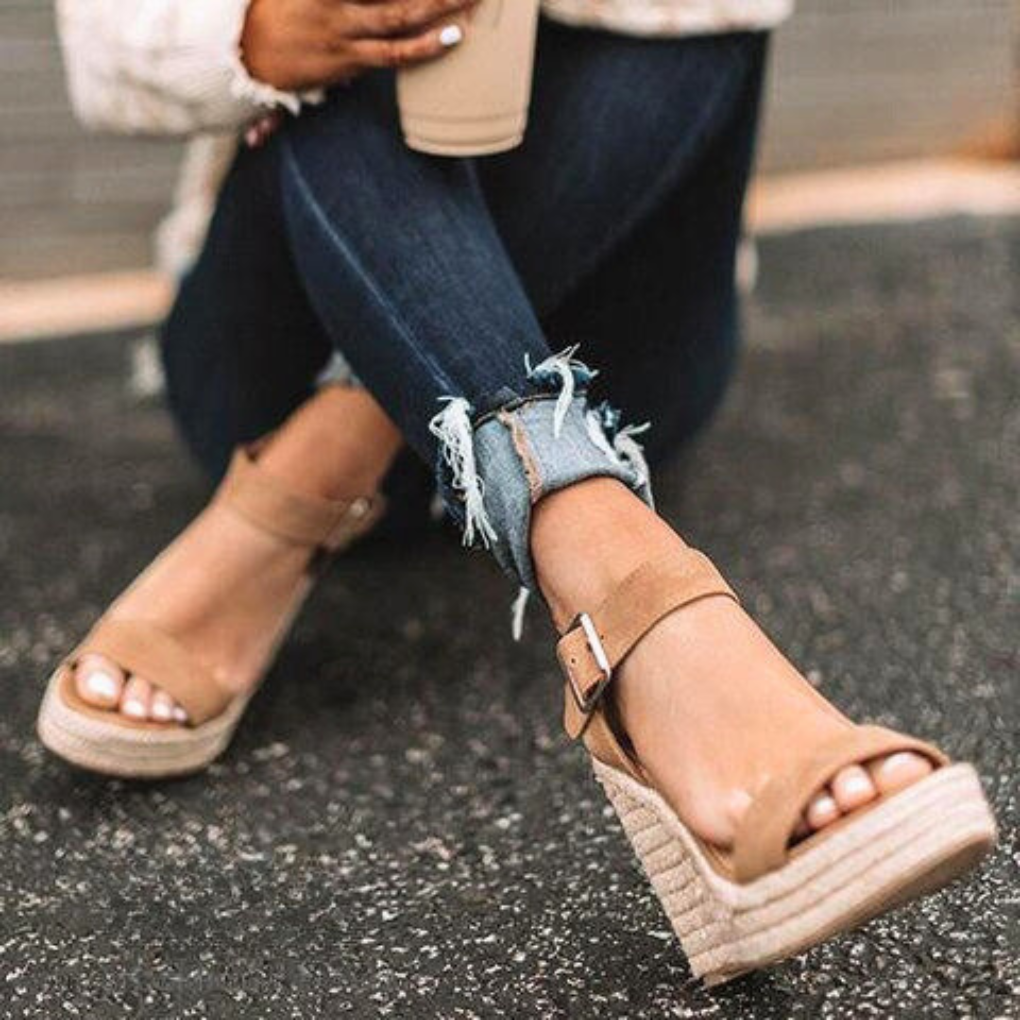 Comfortable women's platform wedge sandals with T-strap design, ideal leisure footwear for summer.