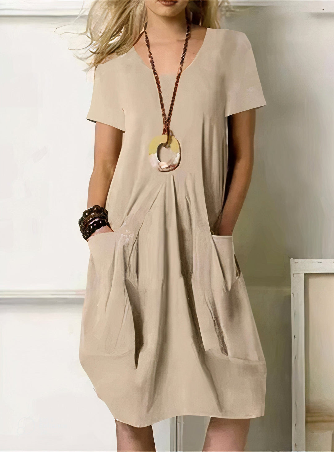 Effortless versatile women's tunic dress, ideal for various casual occasions with its relaxed fit and simple style.