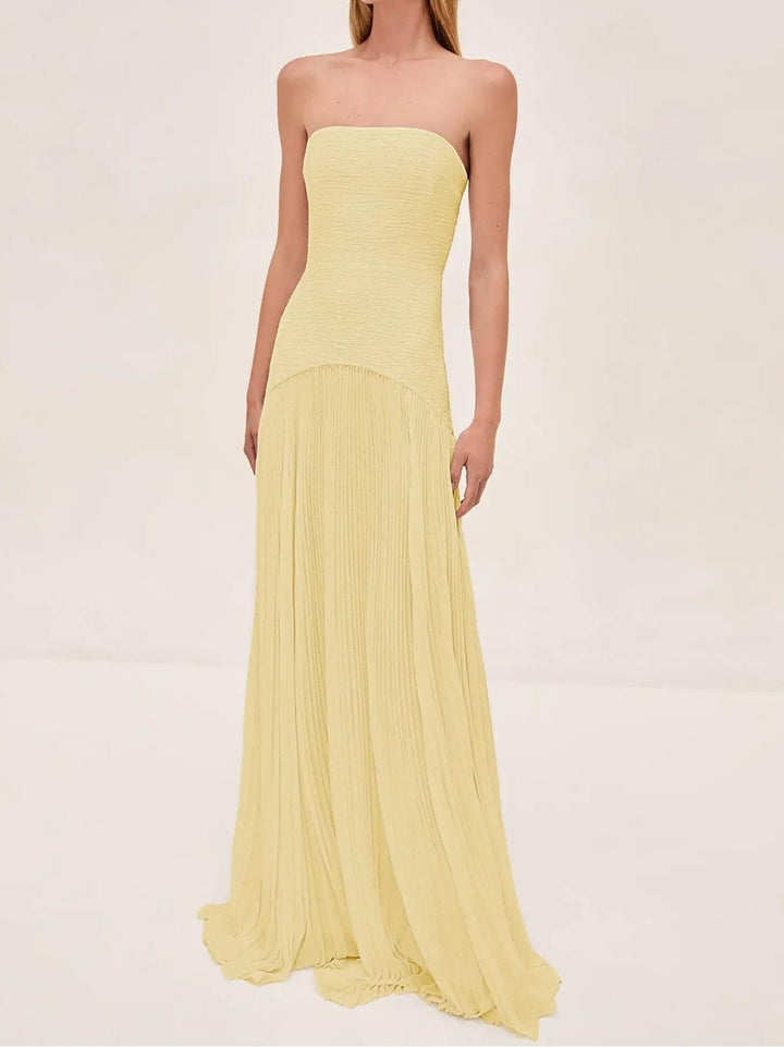 Stylish yellow strapless pleated maxi dress, a perfect women's summer sundress for warm days.