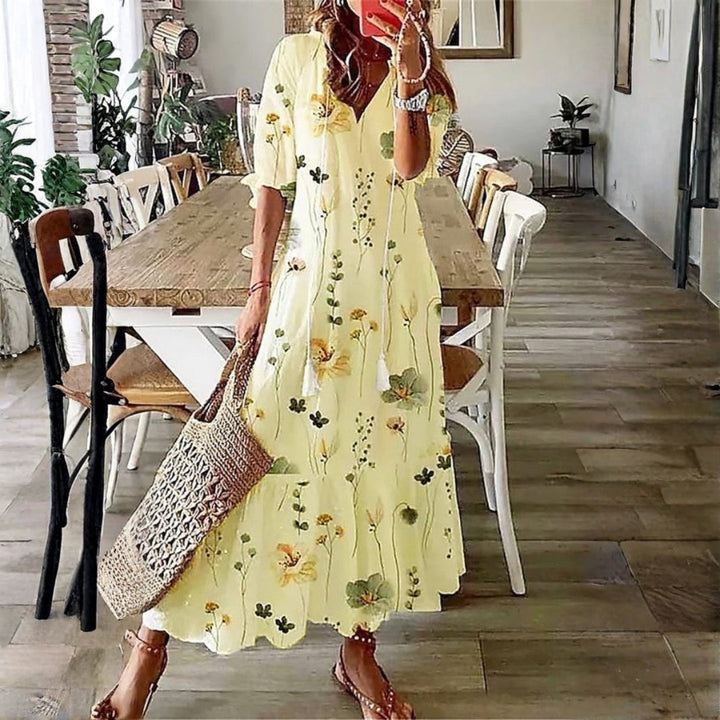 Flowy women's boho floral maxi dress, ideal for elegant beach wear or a comfortable vacation outfit.