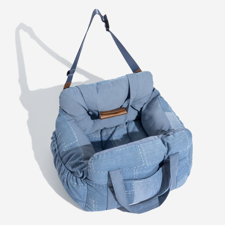Secure dog car booster seat with adjustable straps for pet travel safety & comfort on any trip.