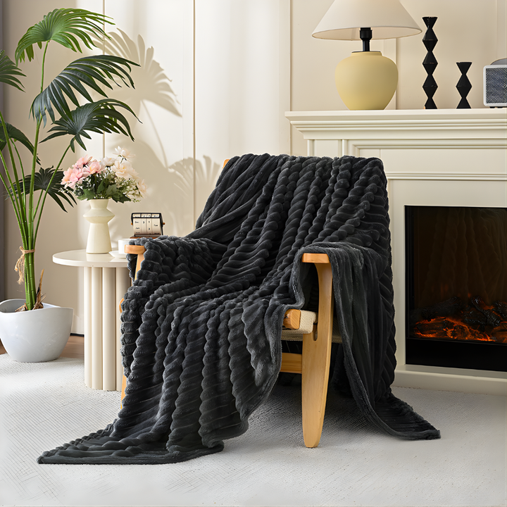 Machine washable faux fur throw blanket, soft & cozy polyester, ideal for comfort and easy home decor.