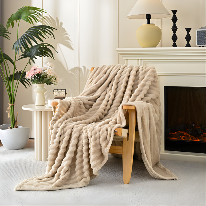 Luxurious soft faux fur throw blanket in neutral colors, perfect decorative accent for cozy home comfort.