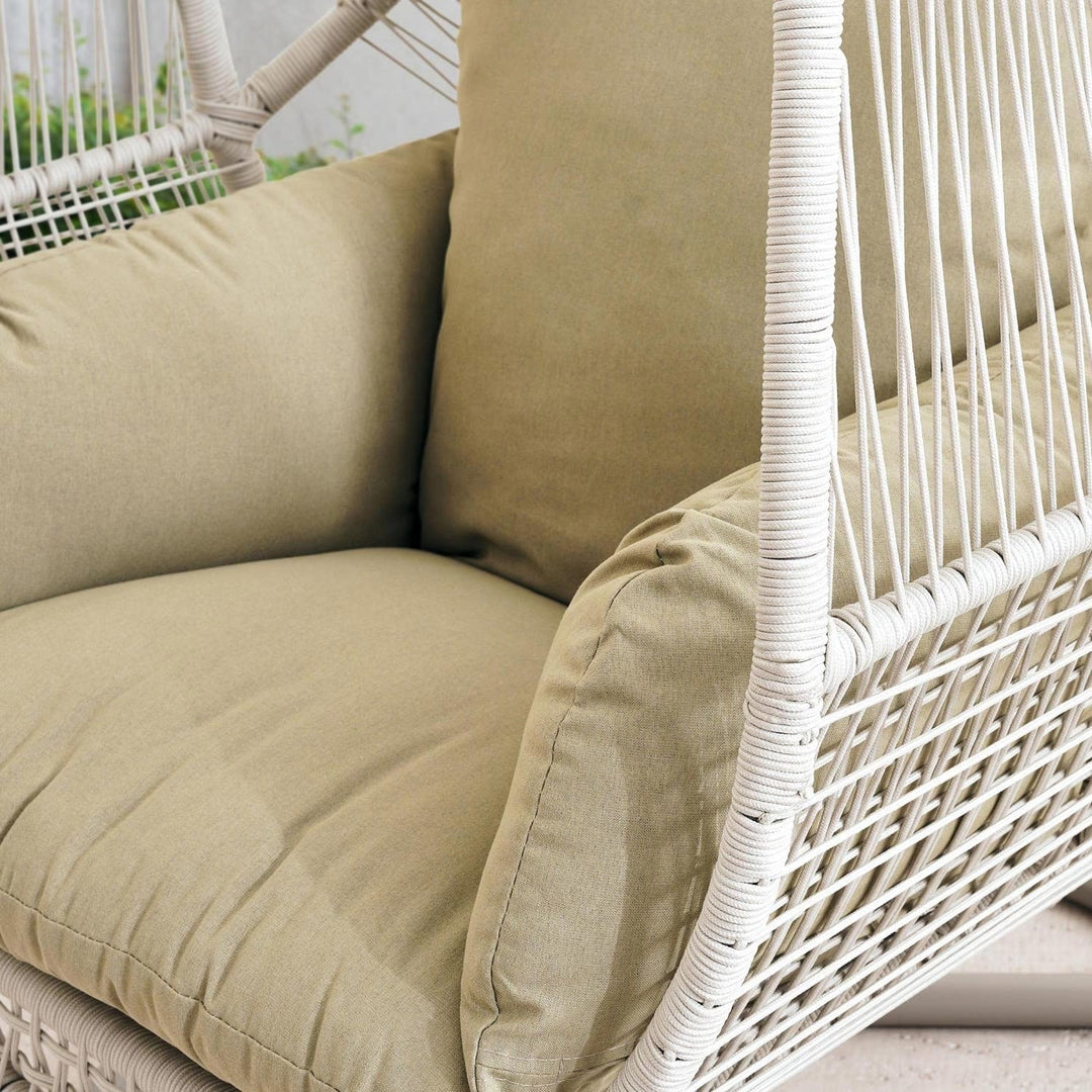 Durable cream outdoor egg swing chair featuring a strong steel frame for garden comfort.