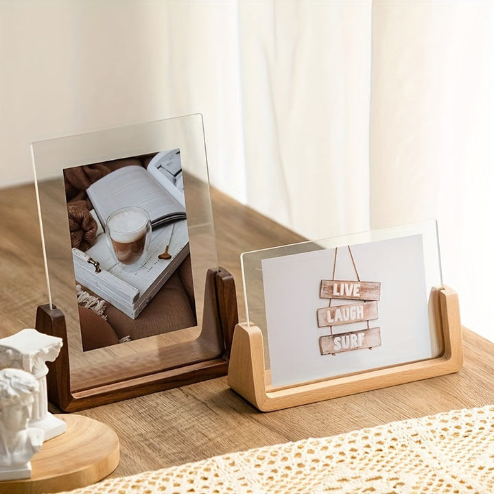 Clear 6-inch acrylic picture frame with a sturdy wood base, ideal for tabletop accent.