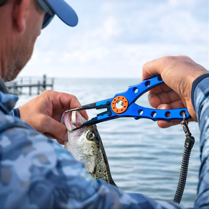 Portable fishing pliers with line cutter and fish gripper, essential for saltwater & freshwater anglers. Easy hook removal.