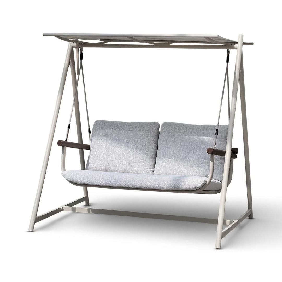 Comfortable cream 2-seater outdoor swing chair for patio or garden, featuring soft cushions & sturdy frame.