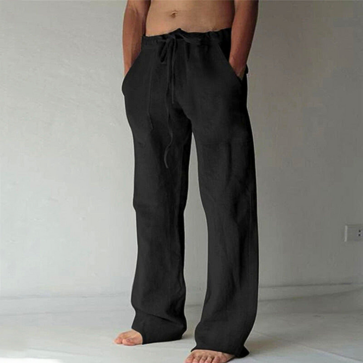 Comfortable men's high-waist wide-leg pants. Soft fabric & adjustable drawstring for ultimate loungewear relaxation.