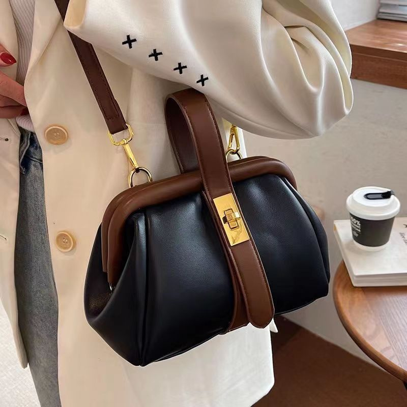 Stylish white women's shoulder bag with adjustable strap, top handle; ideal as a daily travel handbag.
