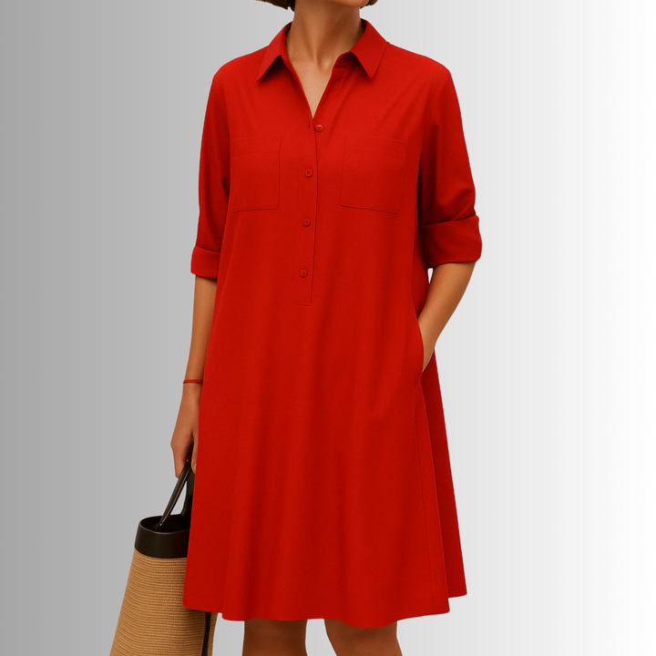 Stylish women's button-front A-line midi dress. Features 3/4 sleeves and pockets for a chic summer look.