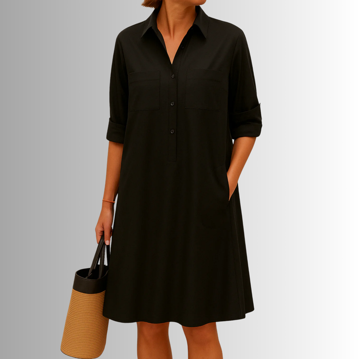 Women's collared A-line button-front midi dress, featuring 3/4 sleeves and pockets. Perfect casual summer outfit.