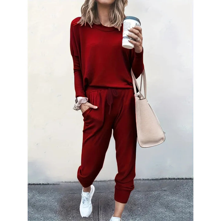 Stylish women's jogger set, a versatile two-piece outfit with crew neck top & tapered pants for casual outings.