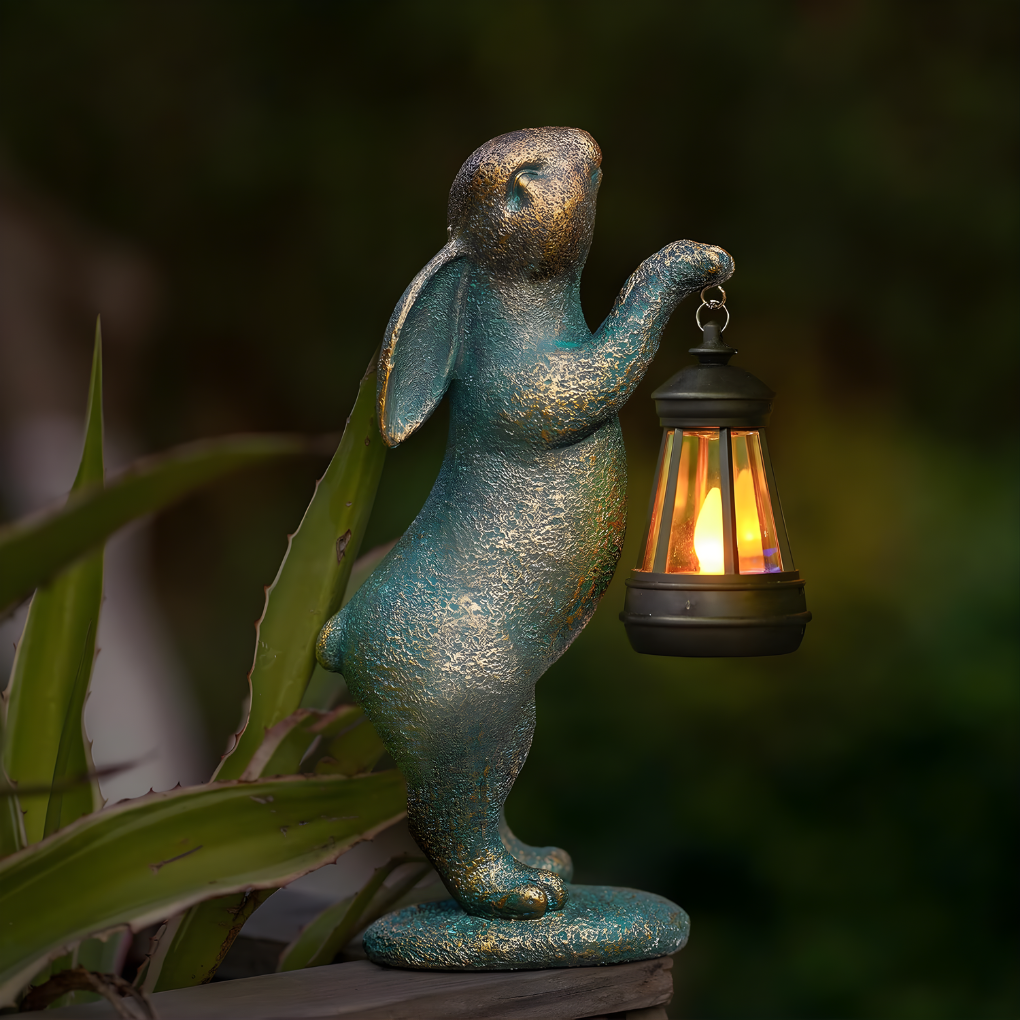 Whimsical bronze rabbit garden statue for outdoor decor, perfect as a patio accent or lawn ornament.