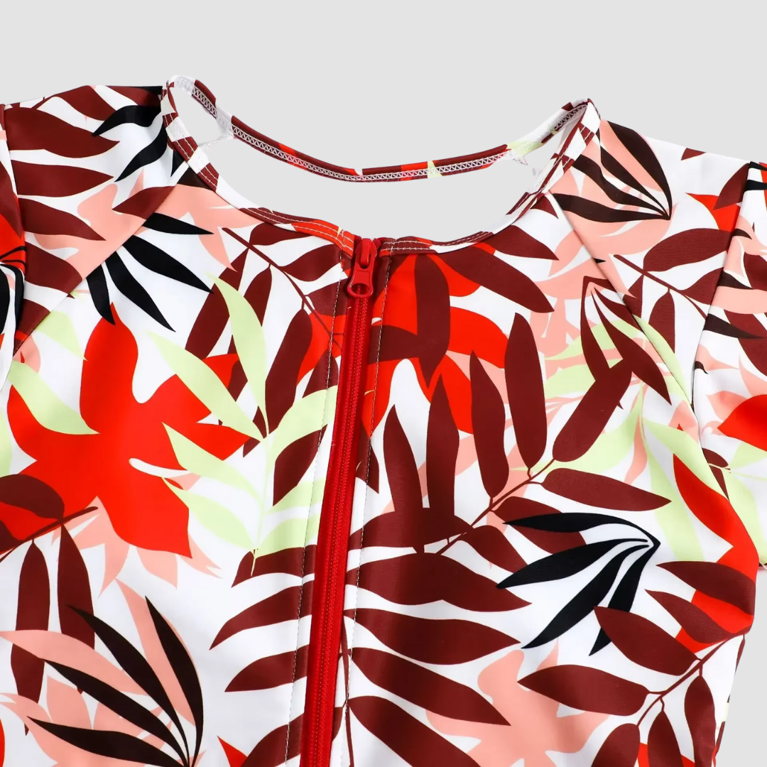 Form-fitting women's one-piece swimsuit with zipper. Combines sporty style with elegant beach and poolside wear.