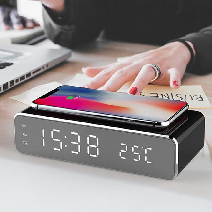 Bedside modern alarm clock with bright LED display & convenient wireless phone charging.
