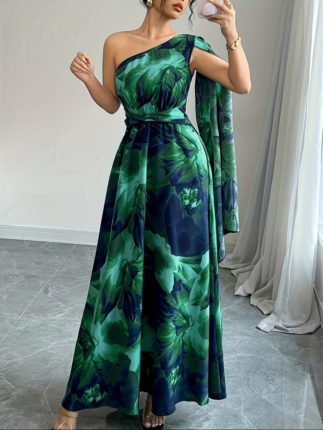 Fashionable one-shoulder floral maxi dress. Elegant attire for wedding guests & evening parties.