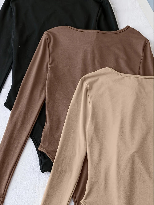 Multi-pack women's long sleeve crew neck bodysuits, designed for a sleek, comfortable slim fit.