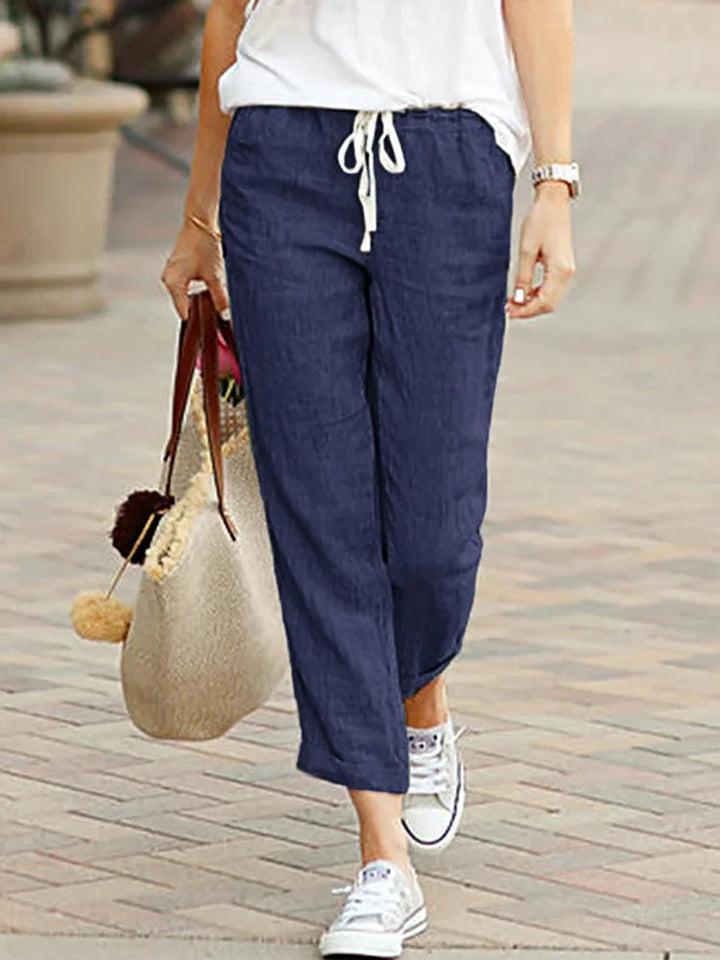 Chic women's cropped pants with elastic waist & straight leg, offering comfort for office & stylish casual wear.