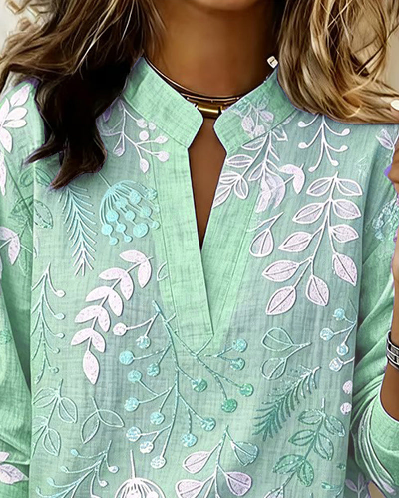 Gorgeous Women's V-Neck Blouse featuring a vibrant pastel floral print, summer ready.