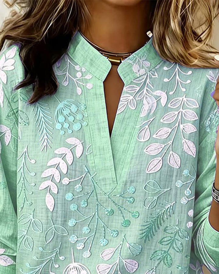 Gorgeous Women's V-Neck Blouse featuring a vibrant pastel floral print, summer ready.