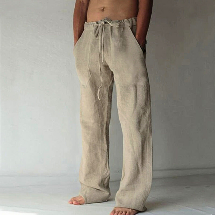 Versatile men's high-waist wide-leg pants. Ideal for casual comfort, features a soft fabric & adjustable drawstring.