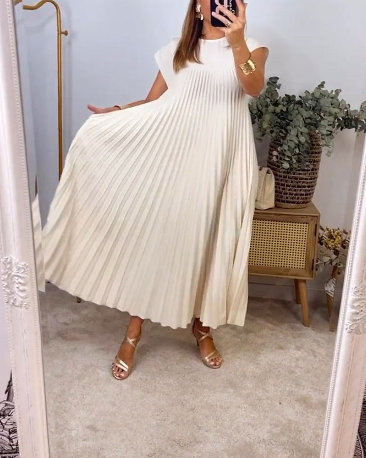 Graceful silhouette of a women's pleated maxi dress, offering flowing design, elegant style & versatility.