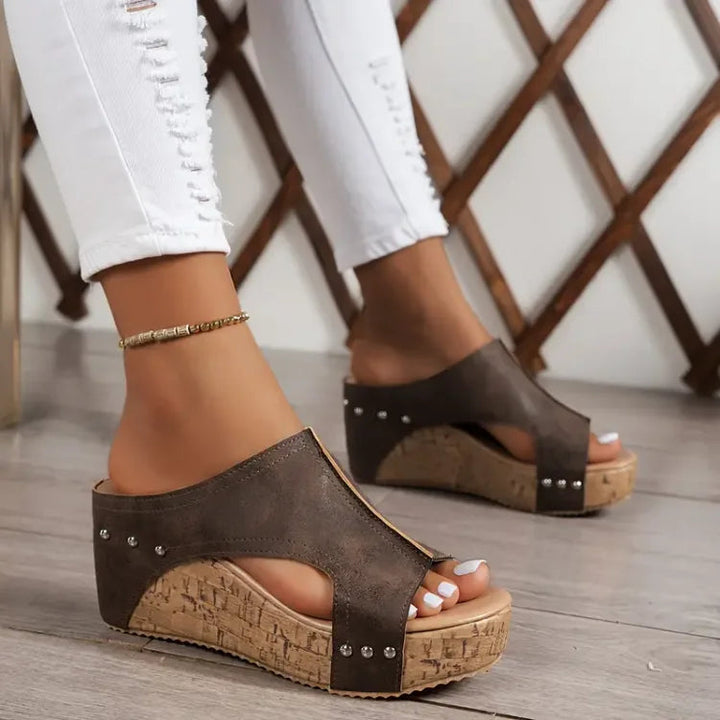 Stylish women's orthopedic wedge sandals offering ultimate comfort, open-toe design, and platform for summer.